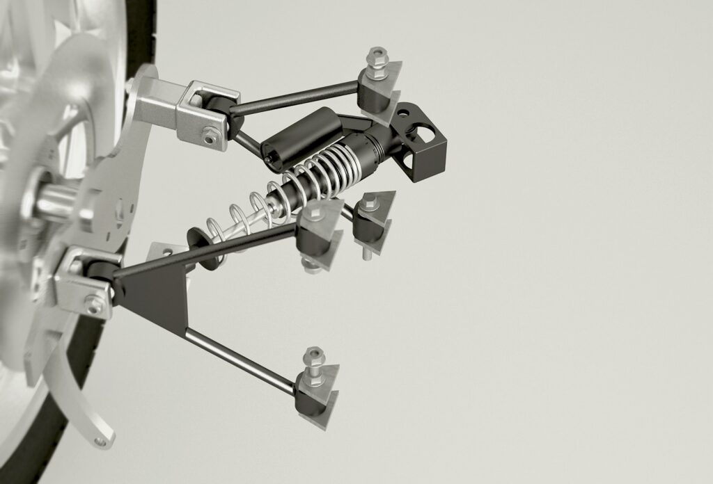 High-quality 3D render of a vehicle suspension system including coil spring, damper, and control arms.
