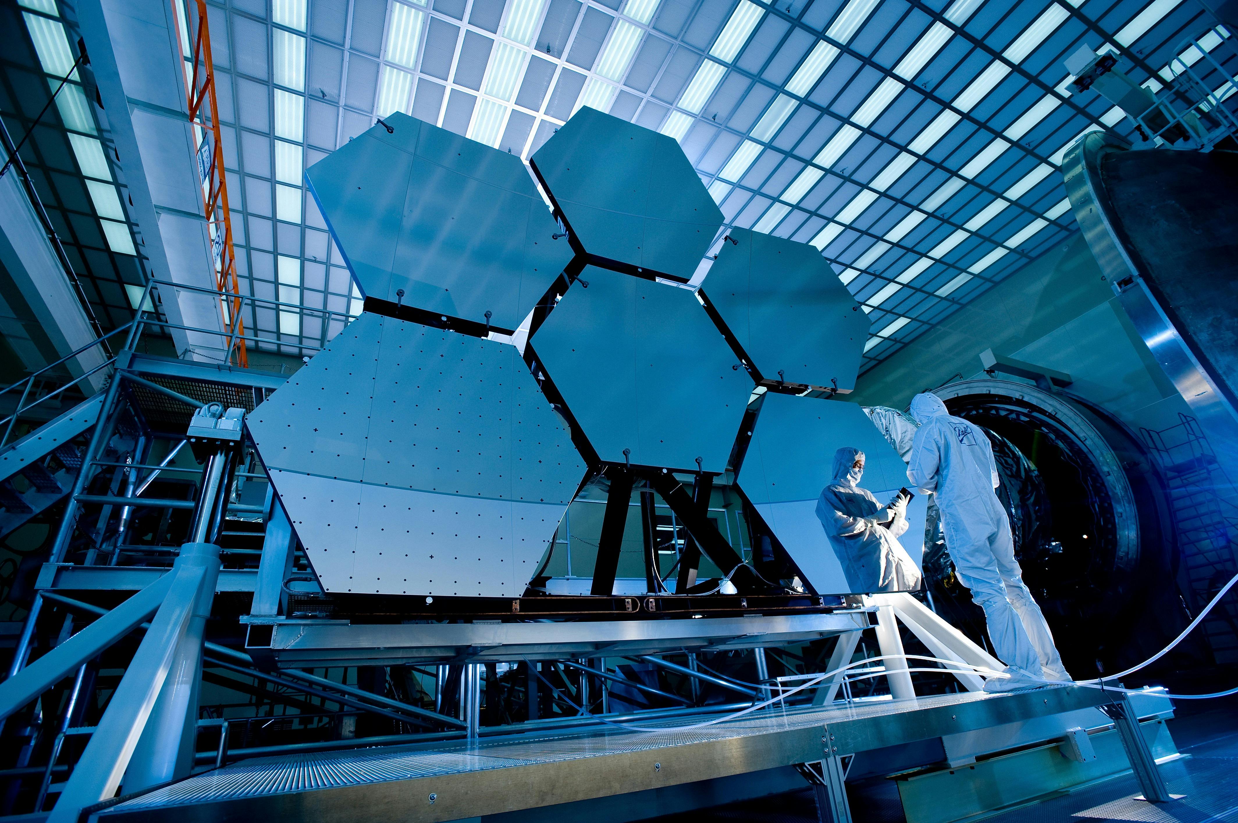 Mechanical engineering service conducting safety inspection near a solar panel installation.